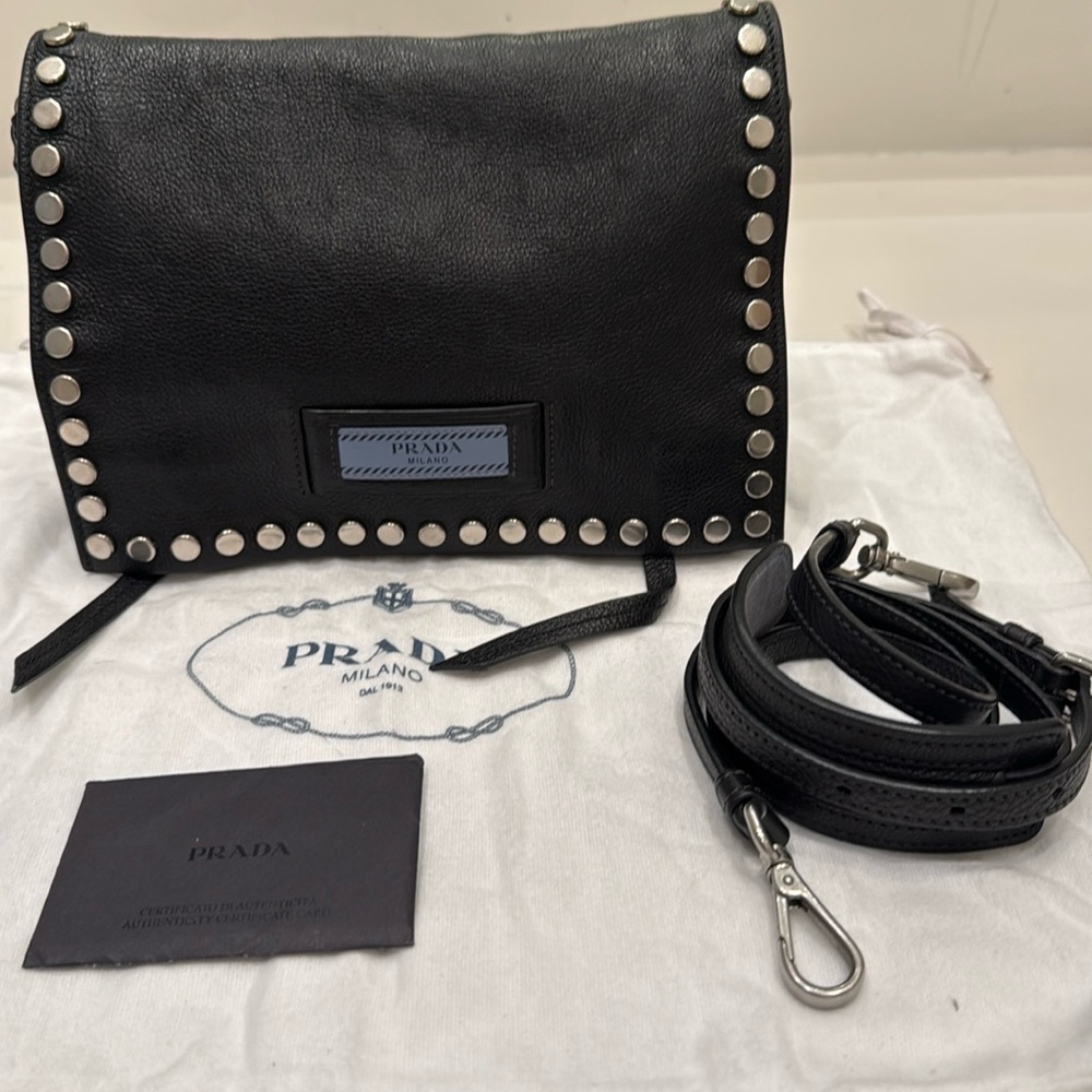 Prada studded etiquette bag.